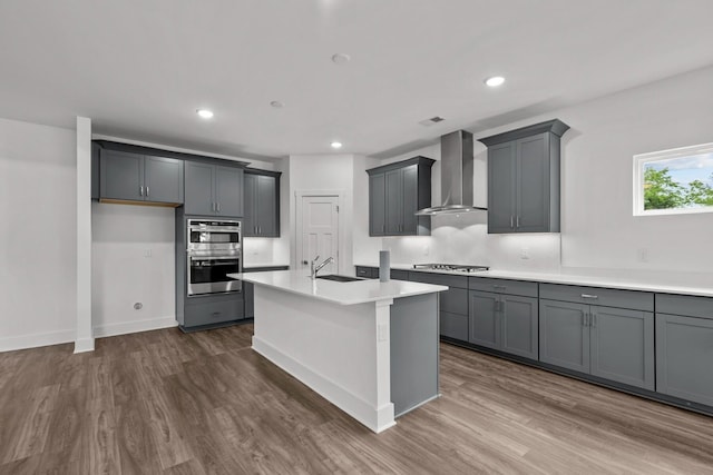 310 Carver Ln, Lebanon, TN 37087 - kitchen featuring wall chimney exhaust hood, stainless steel double oven, dark wood-style floors, a sink, and recessed lighting