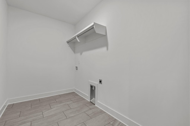 310 Carver Ln, Lebanon, TN 37087 - clothes washing area featuring hookup for an electric dryer, hookup for a washing machine, and baseboards