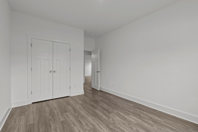 310 Carver Ln, Lebanon, TN 37087 - unfurnished bedroom featuring wood finished floors, baseboards, and a closet
