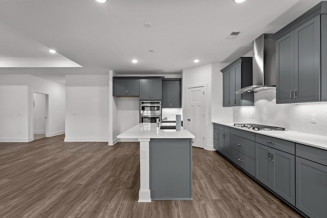 310 Carver Ln, Lebanon, TN 37087 - kitchen with wall chimney range hood, stainless steel appliances, tasteful backsplash, baseboards, and recessed lighting