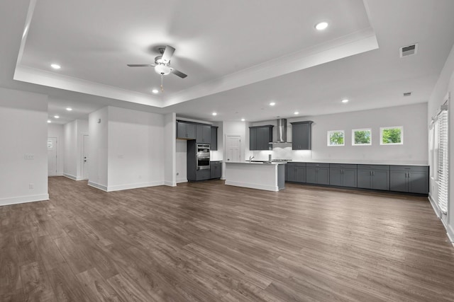 310 Carver Ln, Lebanon, TN 37087 - unfurnished living room featuring a tray ceiling, a ceiling fan, recessed lighting, dark wood finished floors, and baseboards