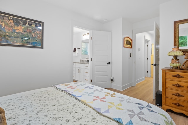 726 Morgan Ave, Woodbury, TN 37190 - bedroom featuring light wood-type flooring, baseboards, and ensuite bathroom
