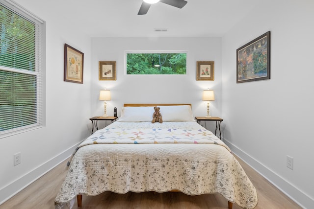 726 Morgan Ave, Woodbury, TN 37190 - bedroom featuring baseboards, wood finished floors, and a ceiling fan