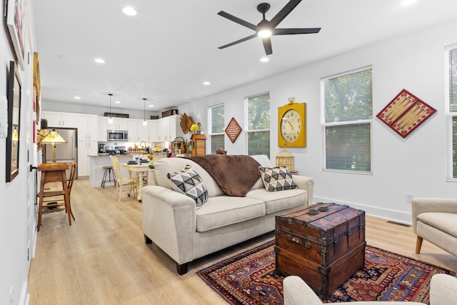 726 Morgan Ave, Woodbury, TN 37190 - living room with light wood-style floors, ceiling fan, recessed lighting, and baseboards
