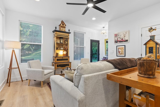 726 Morgan Ave, Woodbury, TN 37190 - living room with light wood finished floors, recessed lighting, a ceiling fan, baseboards, and a chandelier
