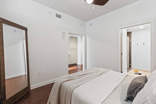 bedroom featuring wood finished floors, baseboards, and a ceiling fan