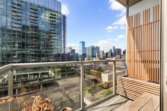 balcony featuring a skyline view