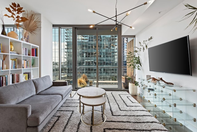 living area featuring a wall of windows and a chandelier
