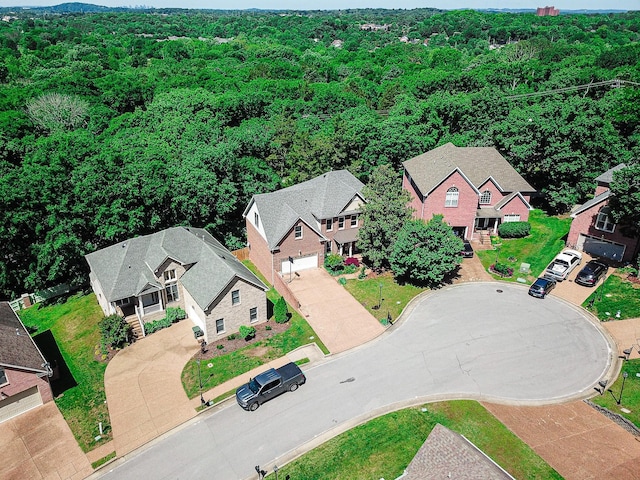 aerial view of residential area with a heavily wooded area
