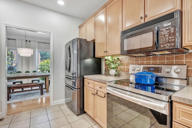 617 Bayhill Ct, Hermitage, TN 37076 - kitchen with appliances with stainless steel finishes, tasteful backsplash, light countertops, light tile patterned flooring, and recessed lighting