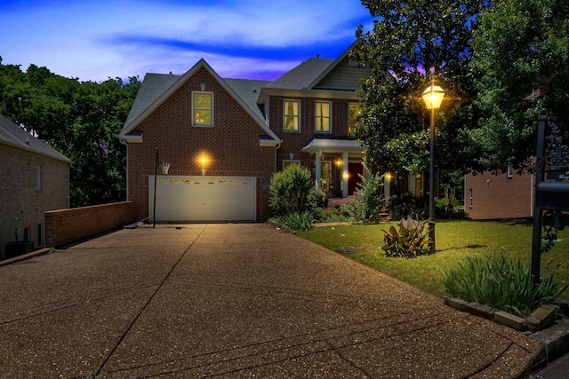 617 Bayhill Ct, Hermitage, TN 37076 - view of front of property with brick siding, driveway, an attached garage, and a front yard