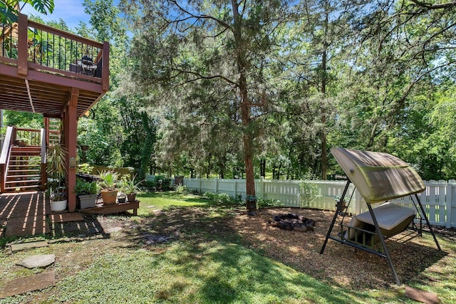 617 Bayhill Ct, Hermitage, TN 37076 - view of yard with stairway, a wooden deck, a fire pit, and view of wooded area