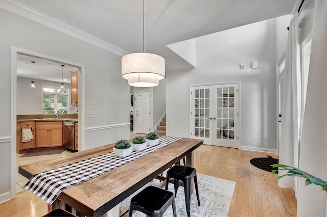 617 Bayhill Ct, Hermitage, TN 37076 - dining space featuring french doors, ornamental molding, light wood finished floors, and baseboards