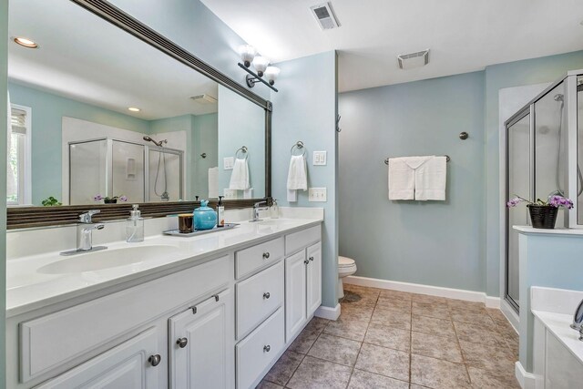 617 Bayhill Ct, Hermitage, TN 37076 - bathroom featuring a shower stall, baseboards, double vanity, toilet, and recessed lighting