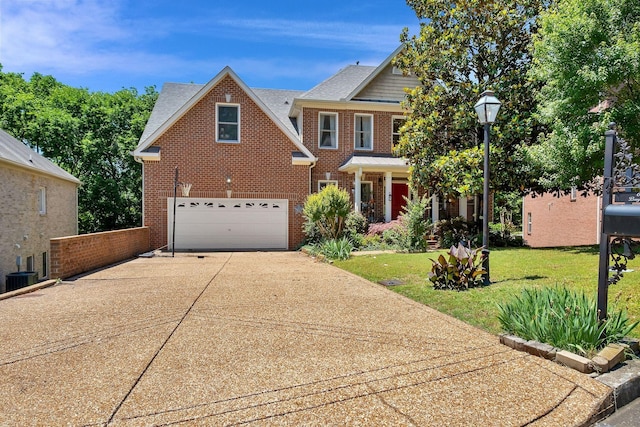 617 Bayhill Ct, Hermitage, TN 37076 - view of front facade with brick siding, concrete driveway, central AC unit, and a garage