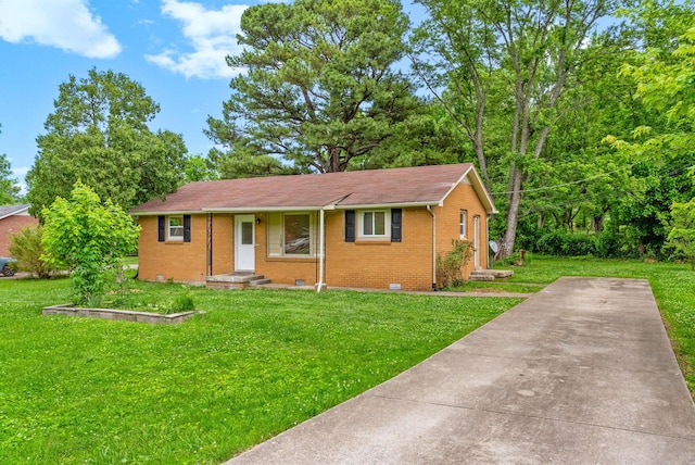 view of front of home with brick siding and a front yard