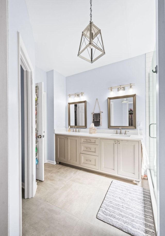 3197 Bush Dr, Franklin, TN 37064 - bathroom with double vanity, a shower with shower door, and tile patterned floors