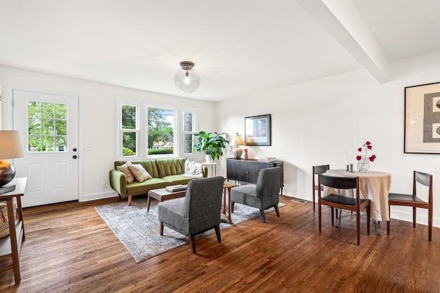 living area with wood finished floors and baseboards
