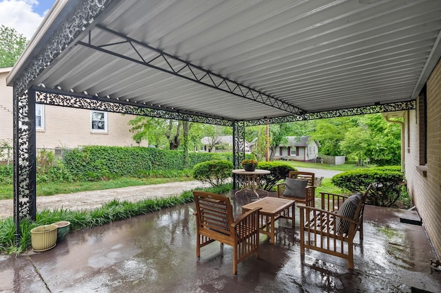 view of patio featuring an outbuilding and a shed
