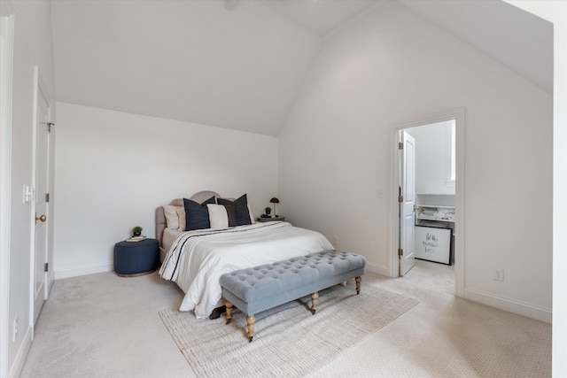 bedroom with lofted ceiling, light colored carpet, and baseboards