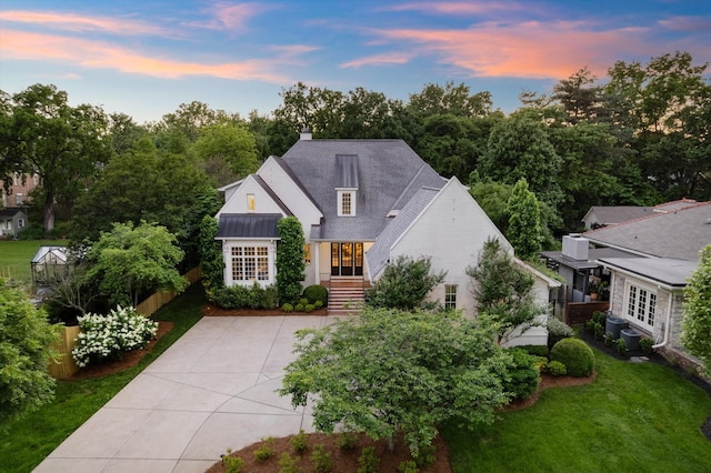 view of front of property with french doors and a chimney