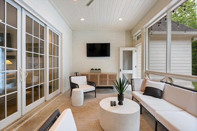 sunroom / solarium with outdoor lounge area and french doors