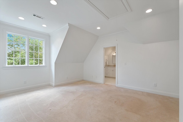 additional living space with attic access, baseboards, light carpet, vaulted ceiling, and recessed lighting