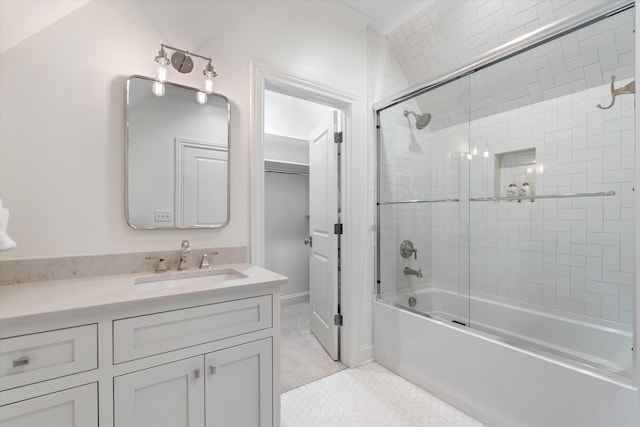 full bath featuring vanity, shower / bath combination with glass door, and tile patterned floors