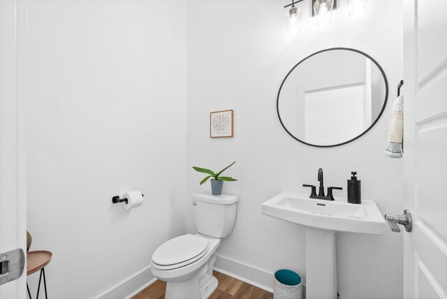 372 Augusta Ave, Pleasant View, TN 37146 - half bathroom with wood finished floors, baseboards, and toilet