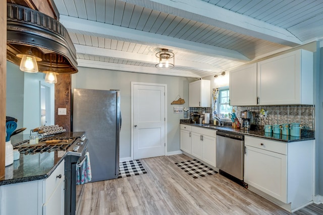 7547 Elm Springs Rd, Orlinda, TN 37141 - kitchen featuring appliances with stainless steel finishes, decorative backsplash, white cabinetry, light wood-style floors, and dark stone countertops