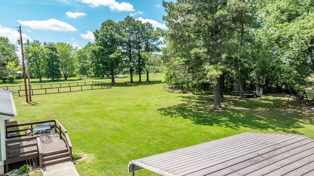7547 Elm Springs Rd, Orlinda, TN 37141 - view of green lawn featuring a wooden deck and view of wooded area