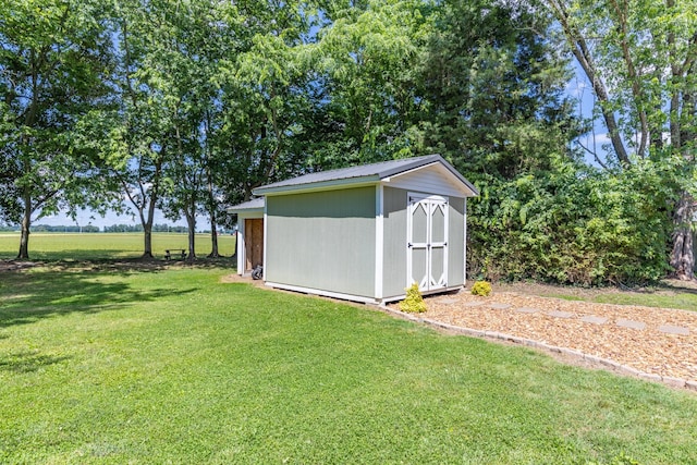 7547 Elm Springs Rd, Orlinda, TN 37141 - view of grassy yard with a storage shed