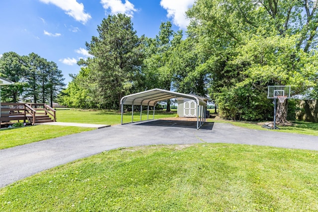 7547 Elm Springs Rd, Orlinda, TN 37141 - view of vehicle parking with a storage shed, a detached carport, and driveway