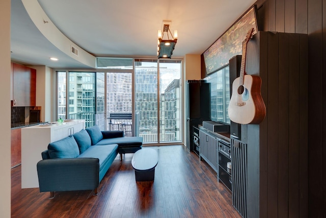 living room with healthy amount of natural light, expansive windows, and dark wood-style flooring