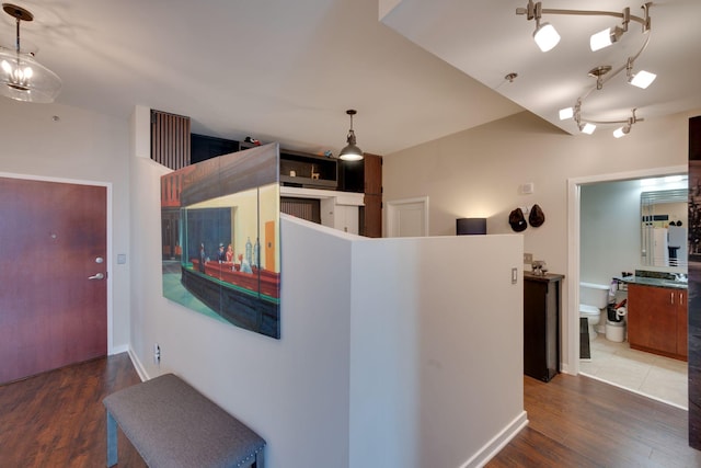 corridor featuring wood finished floors