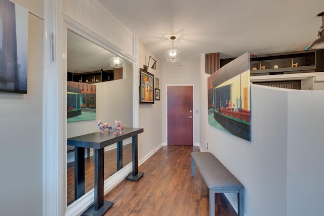 entrance foyer with wood finished floors and baseboards