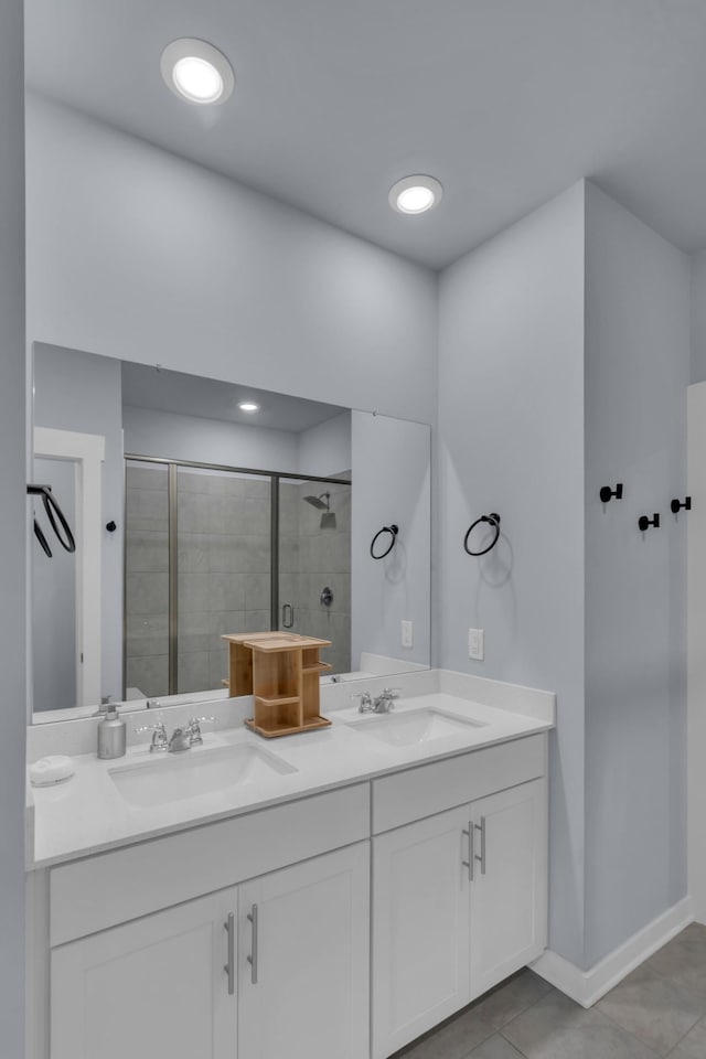 118 Merion Way, Lebanon, TN 37087 - bathroom with a tile shower, double vanity, tile patterned flooring, and baseboards