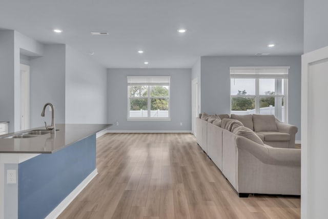 118 Merion Way, Lebanon, TN 37087 - living room featuring light wood-style floors, recessed lighting, and baseboards