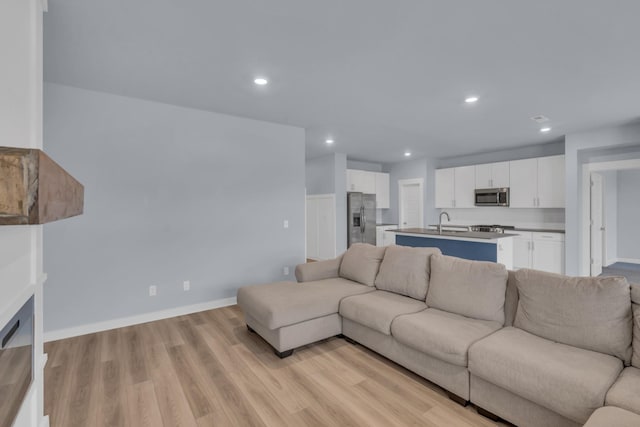 118 Merion Way, Lebanon, TN 37087 - living room featuring recessed lighting, light wood-style floors, and baseboards