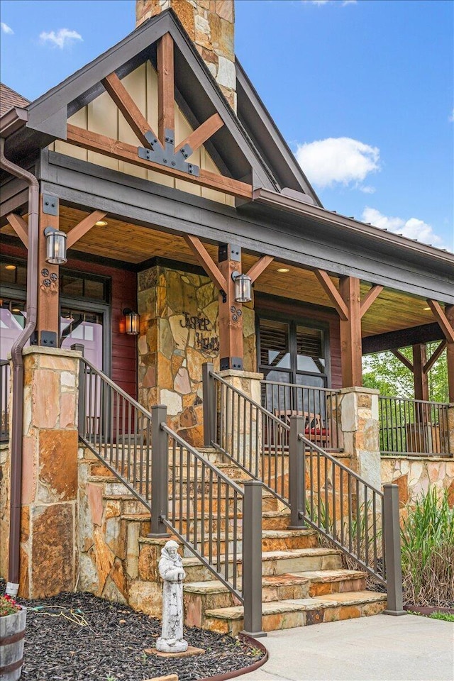 1165 River Bluffs Dr Unit Rb-97, Jasper, TN 37347 - view of front of property with covered porch, stone siding, and a chimney