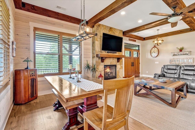 1165 River Bluffs Dr Unit Rb-97, Jasper, TN 37347 - dining space with beam ceiling, healthy amount of natural light, a ceiling fan, a fireplace, and hardwood / wood-style floors