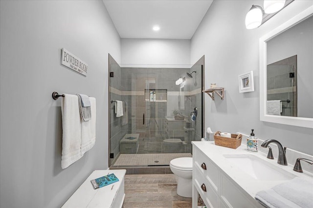 1165 River Bluffs Dr Unit Rb-97, Jasper, TN 37347 - bathroom with a shower stall, toilet, vanity, wood finished floors, and recessed lighting