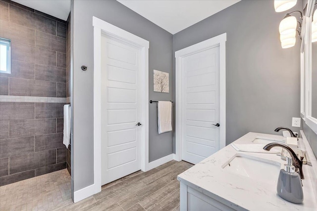 1165 River Bluffs Dr Unit Rb-97, Jasper, TN 37347 - bathroom with a walk in shower, wood finished floors, double vanity, and baseboards