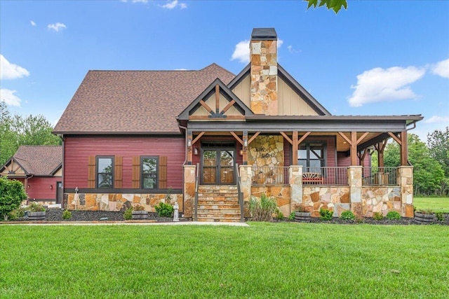 1165 River Bluffs Dr Unit Rb-97, Jasper, TN 37347 - view of front of house with stone siding, a front yard, covered porch, board and batten siding, and a chimney
