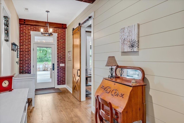 1165 River Bluffs Dr Unit Rb-97, Jasper, TN 37347 - foyer with wood finished floors, a barn door, a chandelier, and wooden walls
