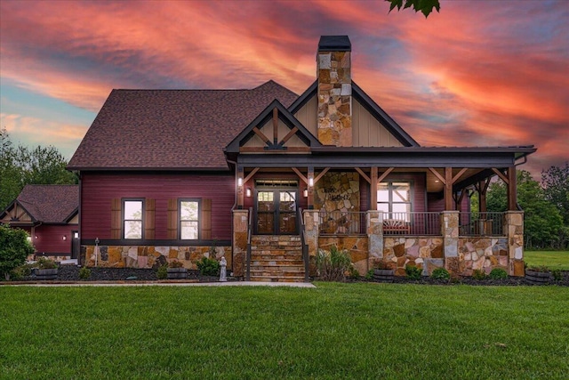 1165 River Bluffs Dr Unit Rb-97, Jasper, TN 37347 - view of front of property featuring stone siding, a lawn, a porch, and a chimney