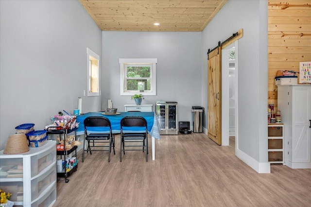 1165 River Bluffs Dr Unit Rb-97, Jasper, TN 37347 - dining room with a barn door, wood finished floors, wooden ceiling, wine cooler, and baseboards