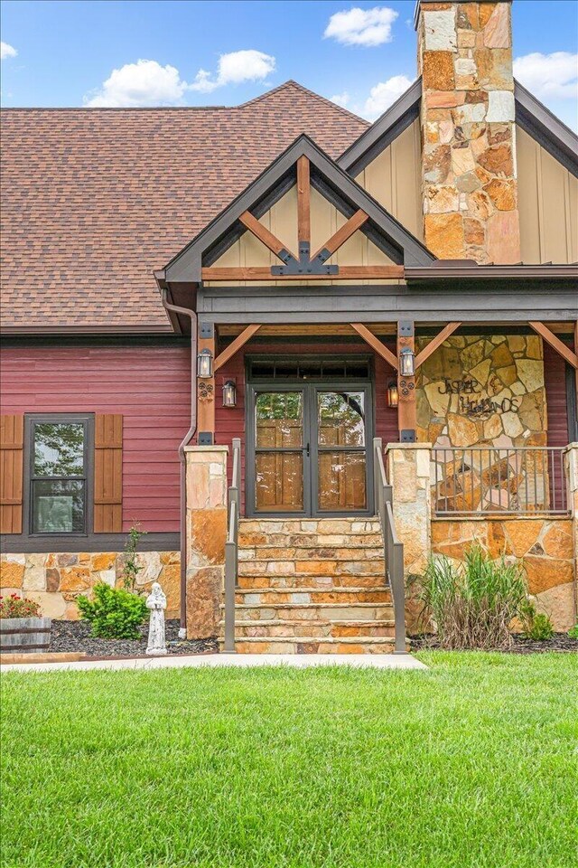 1165 River Bluffs Dr Unit Rb-97, Jasper, TN 37347 - view of front of house with stone siding, a shingled roof, a front yard, and covered porch