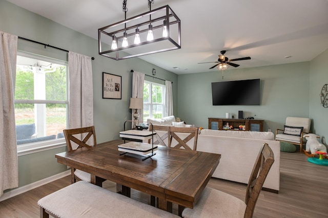 1017 Village Ct, Burns, TN 37029 - dining space with wood finished floors, a ceiling fan, and baseboards