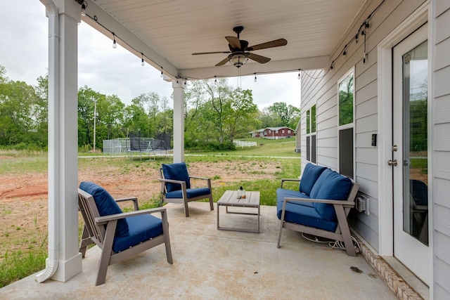 1017 Village Ct, Burns, TN 37029 - view of patio / terrace with a trampoline, a ceiling fan, and an outdoor hangout area